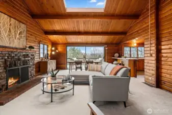 Open concept great room, dining, and kitchen with stunning lake view