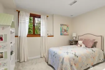 Lower level bedroom, ideal for bedroom or home office, with new plush carpeting and fresh interior paint