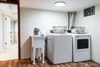 Laundry area, with wash-tub sink, accessible from bonus room, could easily be enclosed with sliding doors