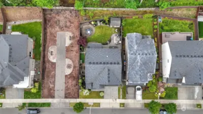 Great aerial view showcases the backyard & the open shared lot next door.