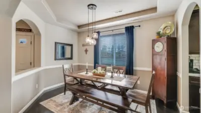 Open and airy formal dining with great architectural arches and tray ceilings.