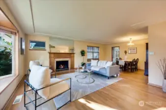 Hardwood floors, woodburning fireplace and bay windows set the stage.