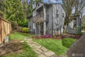 Exterior view with stone walkway to patio
