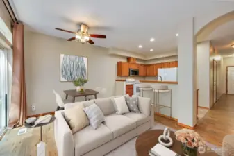Digitally staged living room and dining area.