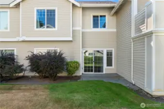 Ground level patio and lawn