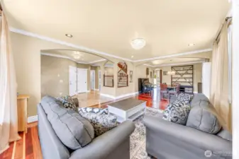 The living room is open to the formal dining area