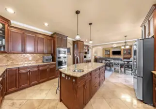 Island with sink and counter seating
