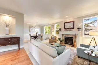 “Entry opens to living and dining rooms with hardwood floors and abundant natural light.”