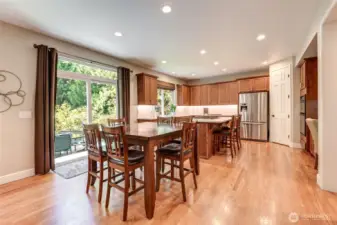 “Casual dining area off the kitchen with sliding door to the patio—seamless indoor-outdoor living and backyard views.”