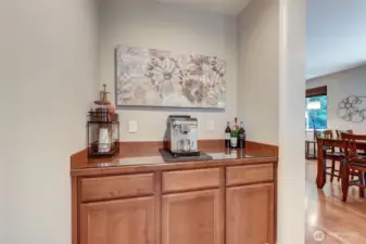 “Butler’s pantry between kitchen and dining room, offering extra storage and seamless serving space.”