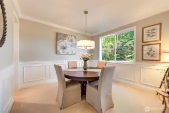 “Elegant dining room with crown molding and direct access to the butler’s pantry. Versatile space—ideal for dining, playroom, home office, or library.”