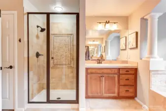 “Spa-like en-suite with walk-in shower and dual vanities, offering both style and convenience.”