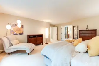 “Spacious primary suite large enough for a sitting area, with windows overlooking the backyard—a relaxing spot to unwind at the end of the day.”
