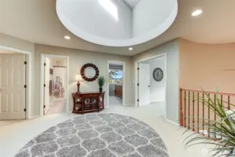 “Expansive loft leads to the oversized family room—an ideal space for gathering, relaxing, or play.”