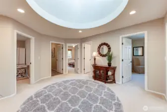 “Loft hallway leads from the family room to the home’s additional bedrooms, maintaining the open and connected upstairs layout.”