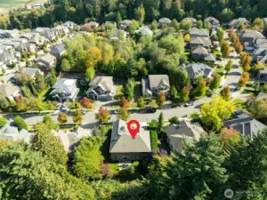 “Stunning aerial view shows this East-facing home perched in a prime position, highlighting its presence and setting as one of the best in the neighborhood.”