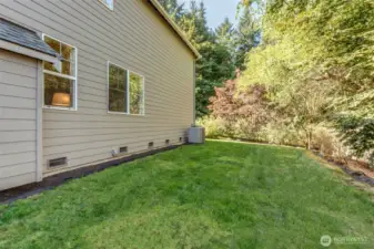 “Spacious side yard with central A/C and durable Hardiplank siding. Large, low-maintenance area perfect for pets and play on a .19-acre lot.”