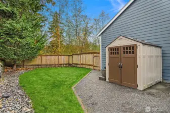 This is one of two fully fenced side yards. Equipped with a shed and access to the 3 car garage. Great dog run
