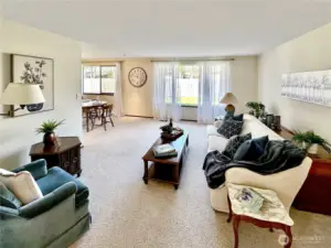 Spacious living room with adjoining dining room for easy entertaining.