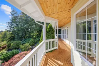 Deck off living and dining with views of the yard and sound.