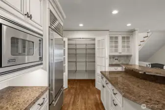 Large walk-in pantry with automatic lighting.