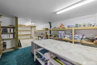 Extra storage space, or work room with extensive shelving  for expansion.