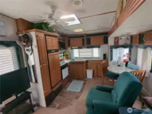 Kitchen offers stove, large refrigerator, sink, pantry and plenty of cupboard space.