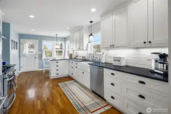 Kitchen with door to back patio and garage