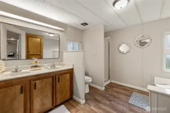 Ensuite in Primary Bedroom with Large Garden Tub and separate Shower