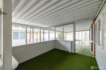 This is an enclosed area on the Deck for an outside seating area.