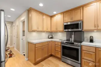 Beautiful solid-wood cabinets stretch to the ceiling, providing tons of storage. Miles of counter-space makes cooking and other hobbies a pleasure!