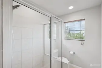 Spacious primary bath tiled shower