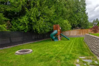 Large lower backyard with tons of space for activities. Very quiet and private back here.