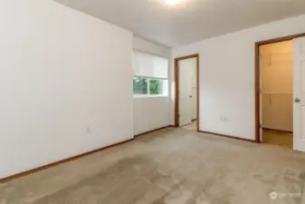 Primary bedroom. View from the head board to walk-in closet & Bathroom area.