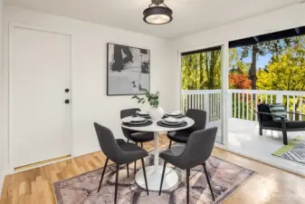 Light filled dining area leads out to deck.