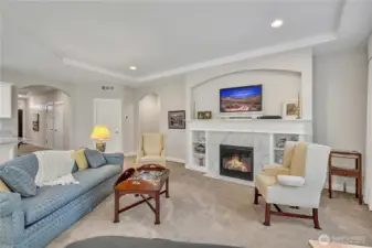 The fireplace creates the perfect ambiance for relaxing or entertaining.