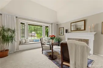 Vaulted ceiling, crown molding, and gas fireplace.