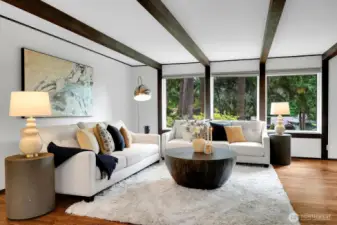 Plenty of light brings the views of trees into this freshly painted home.