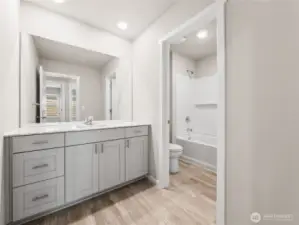 Main hall bath offers separate room for shower/bathtub and toilet.  Finishes and options will vary.