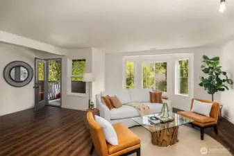 Open living room with ample natural light. Spacious outdoor balcony off of living room to enjoy morning coffee.