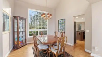 The dining room continues with hardwood floors and vaulted ceilings.  Just steps to the updated kitchen.
