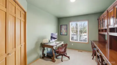 Just off the main entry is a main floor den with a closet.  The piece of furniture on the right is very large and will be removed.