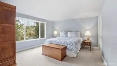 The primary suite also has a view into your own backyard that you will never get tired of looking at.