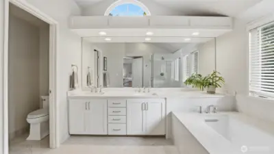 Tile floors, quartz counters, glass wall shower and a sumptuous soak tub.