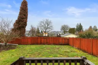 Fenced backyard on studio/salon.
