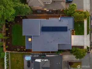 This home contains solar panels. The photo shown above is from a different MN Custom Home with a similar solar array