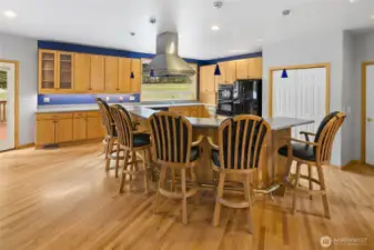 Chef's kitchen features a large eating bar with prep sink, & it seats 6! Barstools included.