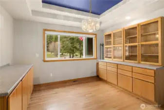 Dining Room with coffered ceilings! Gorgeous built in china cabinet with hutch, and serving buffet.