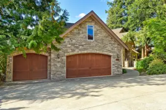 Three car garage with bonus room above accessed from inside the home.