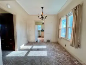 dining room w original hardwood under carpet